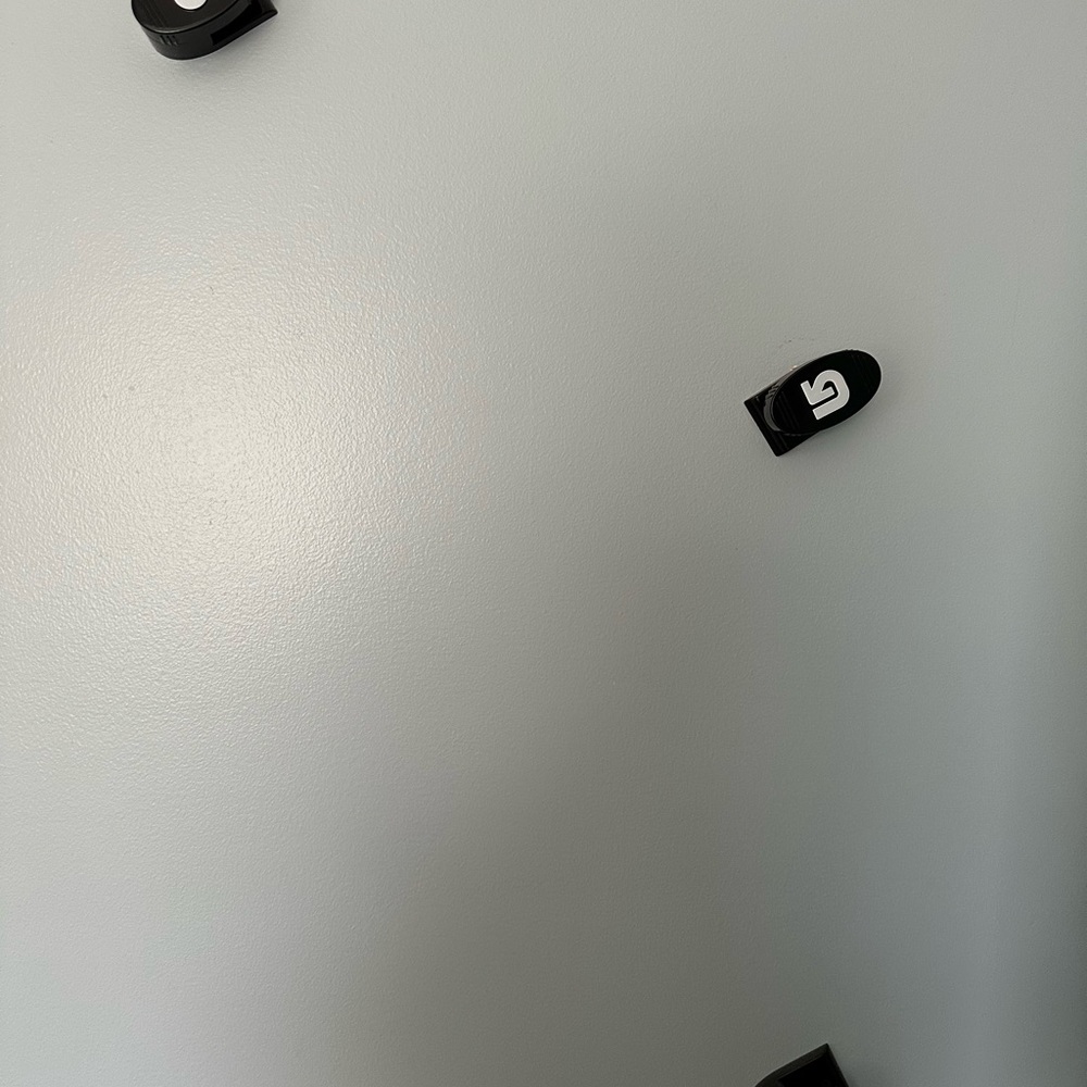 Snowboard wall mounts